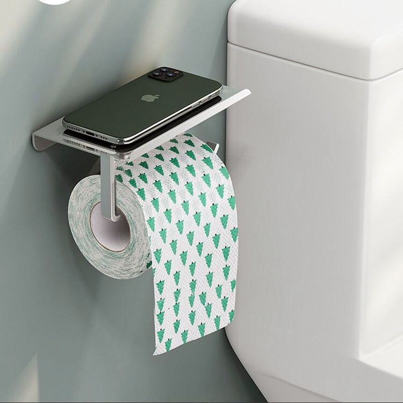 Prático Porta Papel Higiênico com Prateleira para telefone, lenços, e acessórios. Em Aço inox na cor preta para banheiro.